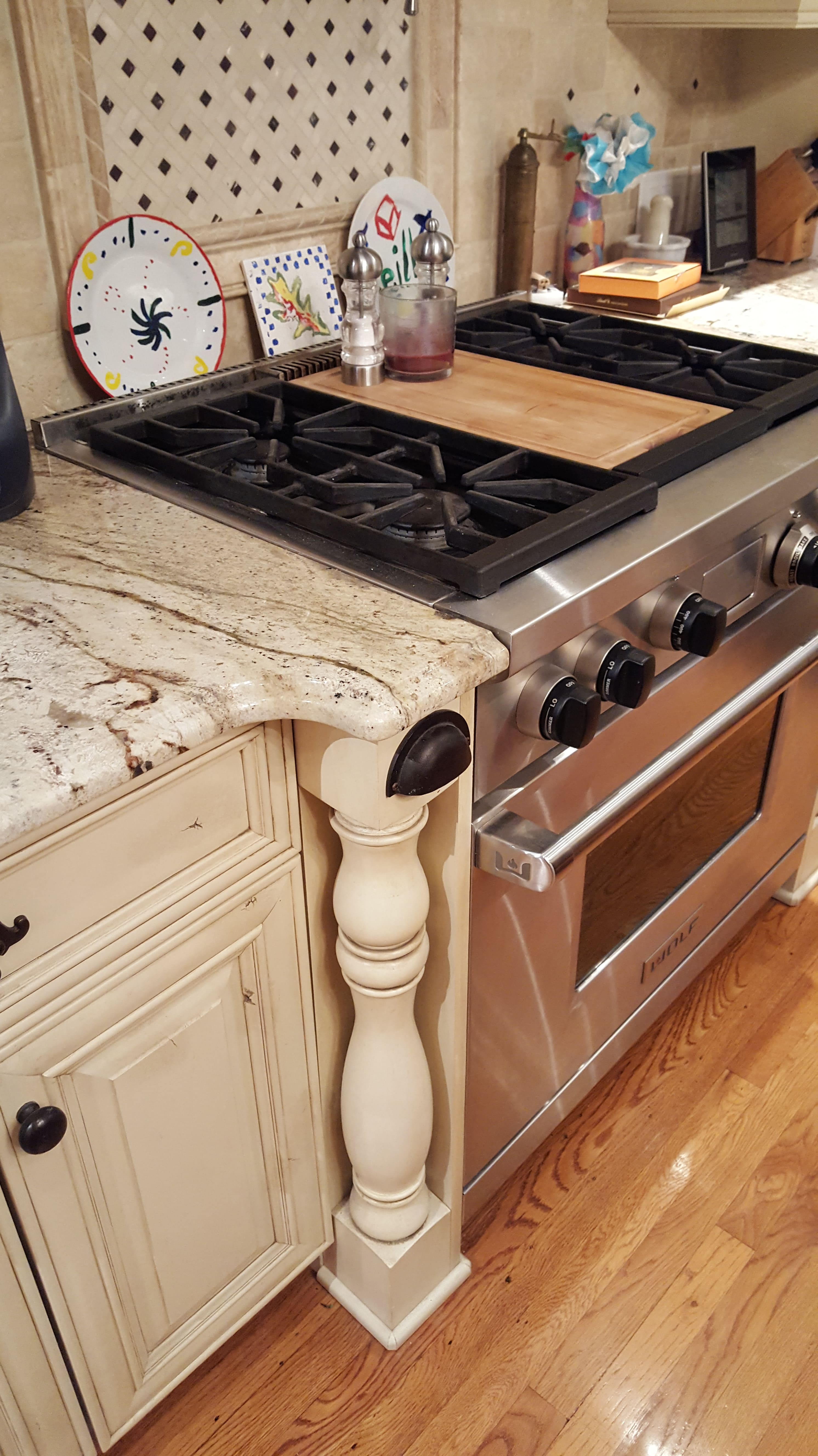 A stove top oven sitting inside of a kitchen